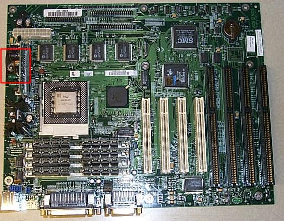 [picture of the front of the damaged motherboard]
